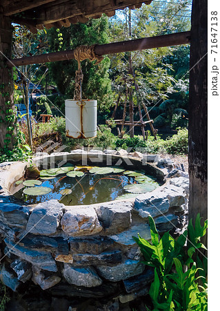 Image of Iron bucket with water well Image of Iron bucket with water well 71647138