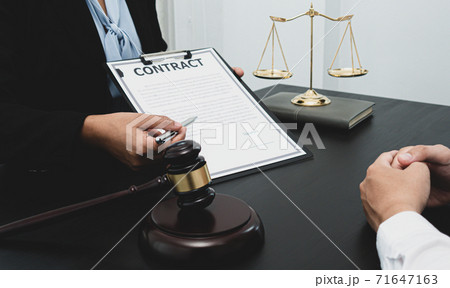 Lawyer or counselor works in the courtroom and negotiates with clients or complainants seeking justice on land encroachment, Law that validity and justice concept. Lawyer or counselor works in the courtroom and negotiates with clients or complainants seeking justice on land encroachment, Law that validity and justice concept. 71647163