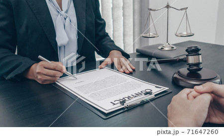 Lawyer or counselor works in the courtroom and negotiates with clients or complainants seeking justice on land encroachment, Law that validity and justice concept. Lawyer or counselor works in the courtroom and negotiates with clients or complainants seeking justice on land encroachment, Law that validity and justice concept. 71647260