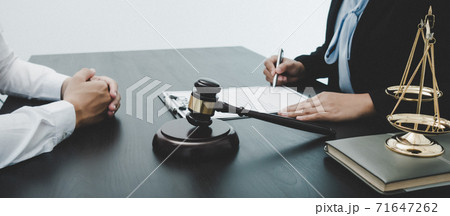 Lawyer or counselor works in the courtroom and negotiates with clients or complainants seeking justice on land encroachment, Law that validity and justice concept. Lawyer or counselor works in the courtroom and negotiates with clients or complainants seeking justice on land encroachment, Law that validity and justice concept. 71647262