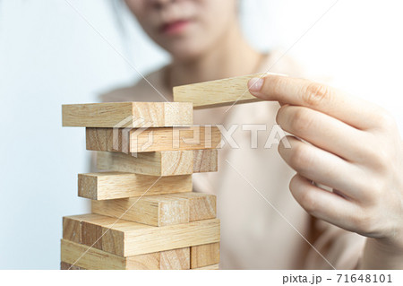 Arrange the wooden blocks into steps, higher the marketing strategy the more effort is required, Driving business at the peak concept. 71648101