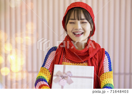 Girl with Christmas gifts Girl with Christmas gifts 71648403