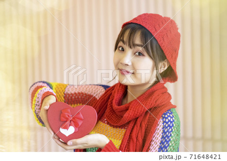 Girl with Christmas gifts Girl with Christmas gifts 71648421