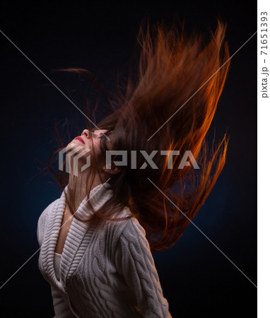 Photo of brunette young woman shaking long hair Photo of brunette young woman shaking long hair 71651393