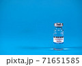 Scientists have found vaccine against SARS-nCoV-2 coronavirus. Coronavirus vaccine in glass medicine bottle on blue background with space for text. Victory over SARS-nCoV-2 coronavirus epidemic 71651585
