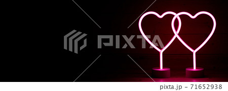 Two glowing pink neon hearts 71652938