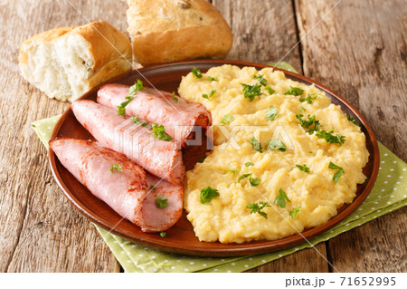 British dish is simply made using yellow split peas pease pudding serve this comforting side dish with ham closeup on the table. horizontal 71652995