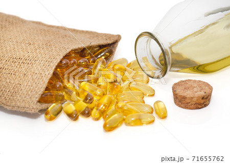 Omega 3 capsules in a bag and a bottle of fish oil Omega 3 capsules in a bag and a bottle of fish oil 71655762
