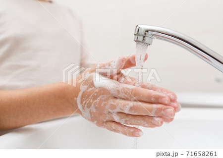 Washing hands in the bathroom. Washing hands in the bathroom. 71658261