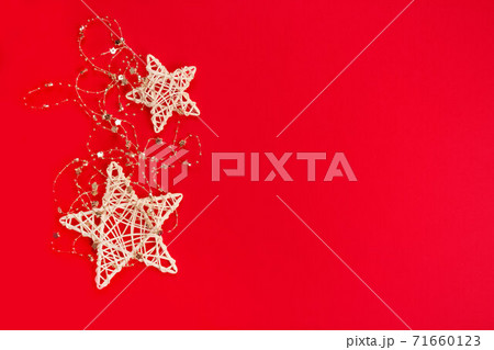 Beautiful Christmas and New Year composition with white Christmas stars on red background. Festive backdrop with copyspace for your project or greeting card 71660123