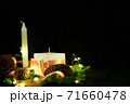 Pink Christmas decorations with candlels on a black background 71660478