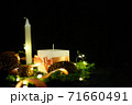 Pink Christmas decorations with candlels on a black background 71660491