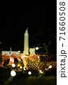 Pink Christmas decorations with candlels on a black background 71660508