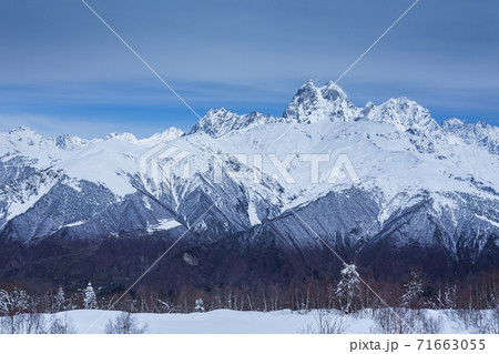 Panoramic view on high snowy mountains in winter at sunny day. Caucasus Mountains, Mount Ushba. Svaneti region of Georgia Panoramic view on high snowy mountains in winter at sunny day. Caucasus Mountains, Mount Ushba. Svaneti region of Georgia 71663055