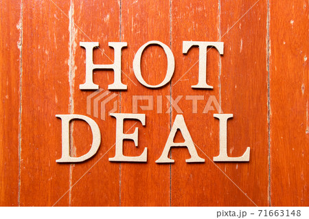 Alphabet letter in word hot deal on old red color wood plate background 71663148