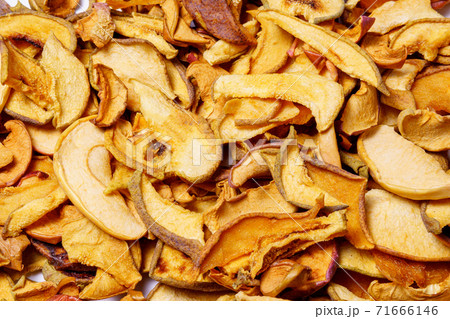 dried apple slices, dried fruit chips texture background, closeup. healthy food dried apple slices, dried fruit chips texture background, closeup. healthy food 71666146