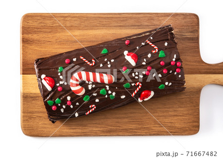 Chocolate yule log christmas cake isolated on white background 71667482