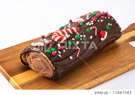 Chocolate yule log christmas cake isolated on white background 71667483