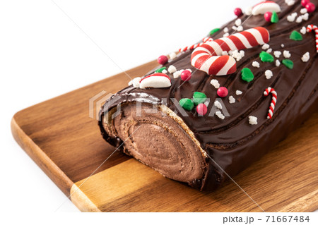 Chocolate yule log christmas cake isolated on white background 71667484