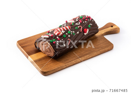 Chocolate yule log christmas cake isolated on white background 71667485