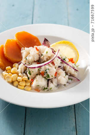 Traditional peruvian ceviche with fish, sweet potato, corn and vegetables 71667599