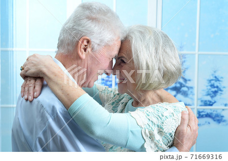 Happy senior couple on Christmas at home 71669316