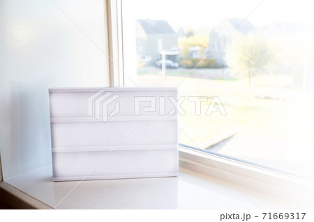 Blank empty Lightbox on window silk in a bright room with daylight, copy space or space for text. Modern design background 71669317