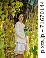 Warm autumn portrait of young pretty woman. 71670144