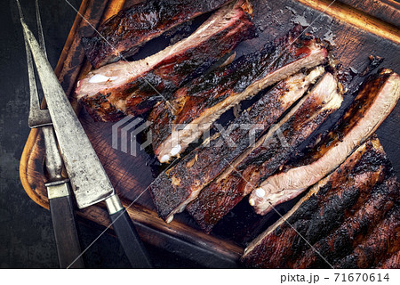 Barbecue veal spare ribs St Louis cut with hot honey chili marinade sliced Barbecue veal spare ribs St Louis cut with hot honey chili marinade sliced 71670614