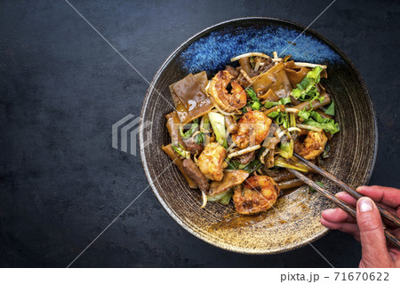 Thai Pad See Ew Noodles with vegetable and king prawns and beef  Thai Pad See Ew Noodles with vegetable and king prawns and beef  71670622