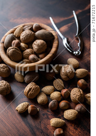 winter mix nuts image with hand cracker winter mix nuts image with hand cracker 71672215