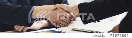 Greeting and meeting, business partners as partners shaking hands to congratulate each other to work together, Building friendship in real estate investment , handshake concept. 71676892