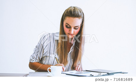 Blonde business woman working at modern office. 71681689