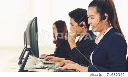 Business people wearing headset working in office 71682322