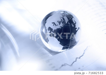 Glass globe and financial charts Glass globe and financial charts 71682533
