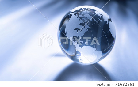 Glass globe on gray background 71682561