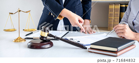Consultation and conference of female lawyers and professional businesswoman working and discussion having at law firm in office. Concepts of law, Judge gavel with scales of justice 71684832