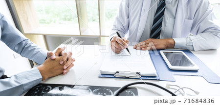 Professor Doctor consulting with patient discussing something and recommend treatment methods, Presenting results on report and x-ray film, Medicine and health care concept 71684836