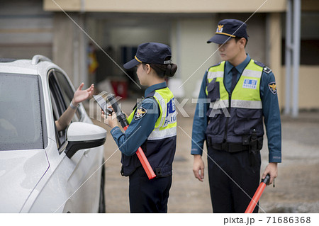 Asian male and female two police officers 125 Asian male and female two police officers 125 71686368