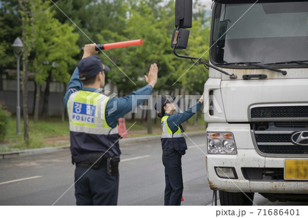 Asian male and female two police officers 135 Asian male and female two police officers 135 71686401