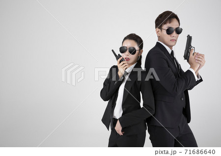 Asian male and female two security guards 123 71686640