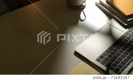 Workspace with laptop, supplies and copy space in office room 71692267