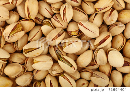 Background of fresh roasted pistachio nuts Background of fresh roasted pistachio nuts 71694404