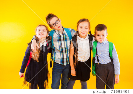 The classmates friends stand together and look at the camera 71695402