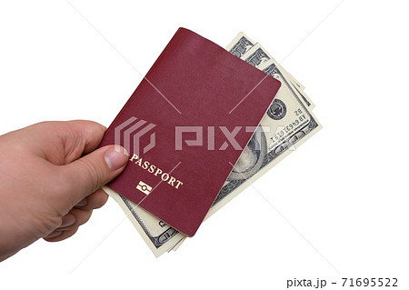 Passport and money in the hands of a man on a white background Passport and money in the hands of a man on a white background 71695522