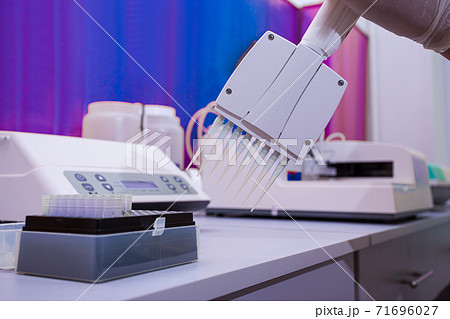 Robotic dispensing machine in modern biochemical laboratory Robotic dispensing machine in modern biochemical laboratory 71696027