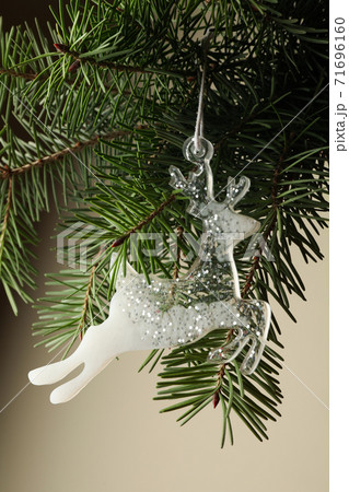 Pine branch with reindeer bauble, close up 71696160