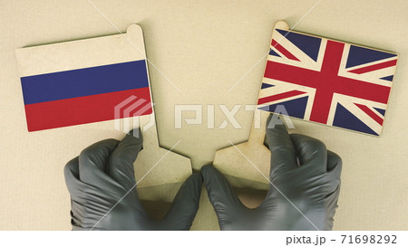 Flags of Russia and the United Kingdom made of recycled paper on the cardboard table Flags of Russia and the United Kingdom made of recycled paper on the cardboard table 71698292