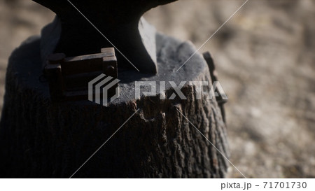 Old anvil attached to a stump Old anvil attached to a stump 71701730