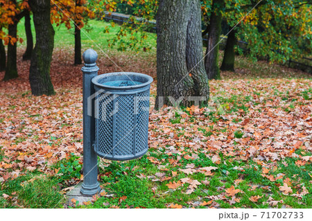 trash can in autumn park 71702733